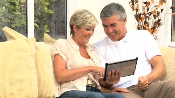 Middle Aged Couple Having Success Online — Stock Video