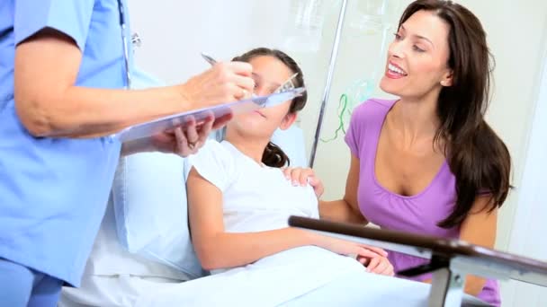 Mother with Little Girl Being Treated by Hospital Nurse — Stock Video