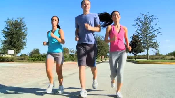 Young Friends Jogging Together — Stock Footage Young Friends Jogging Together Royalty Free Stock Video