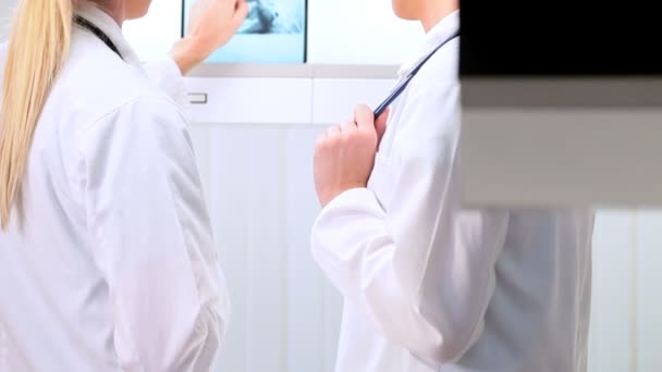 Young Doctors Viewing X-Ray Film — Stock Video