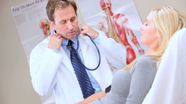 Hospital Clinic Doctor Taking Patients Blood Pressure — Stock Video