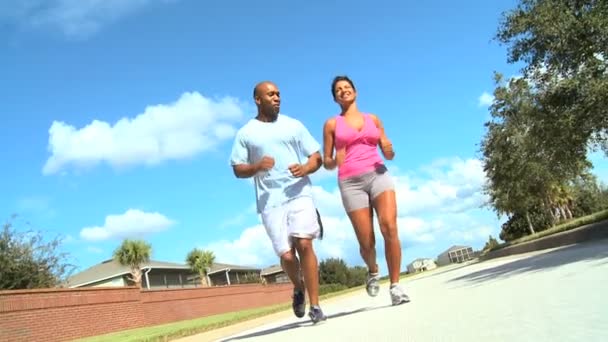 Ethnic Female Jogging with Personal Trainer — Stock Video