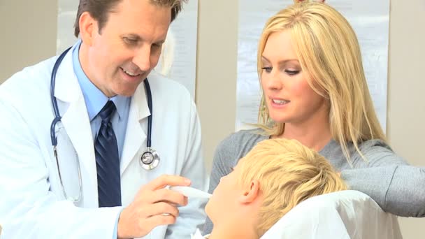 Young Caucasian Boy with Doctor at Hospital Clinic — Stock Video