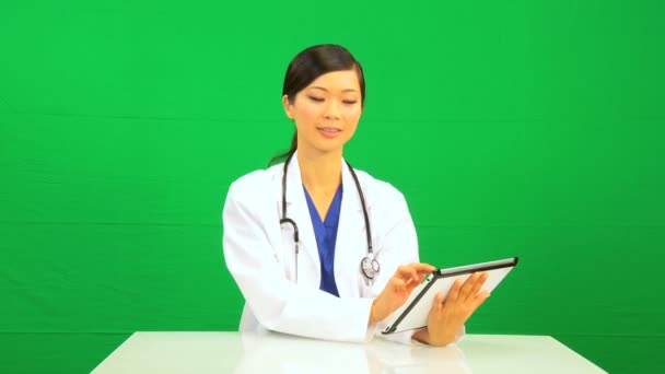 Asian Chinese Female Doctor Wireless Tablet Green Screen — Stock Video