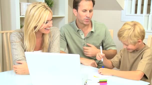 Young Boy Using Laptop and Crayons for Project — Stock Video