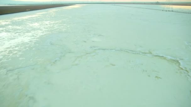 Aerial view of environment which will produce salt from the ponds — Stock Video