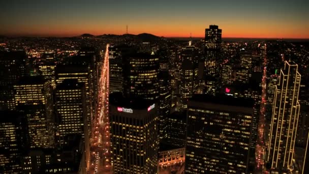 Aerial night view of skyscrapers, rooftops and city streets, USA — Stock Video