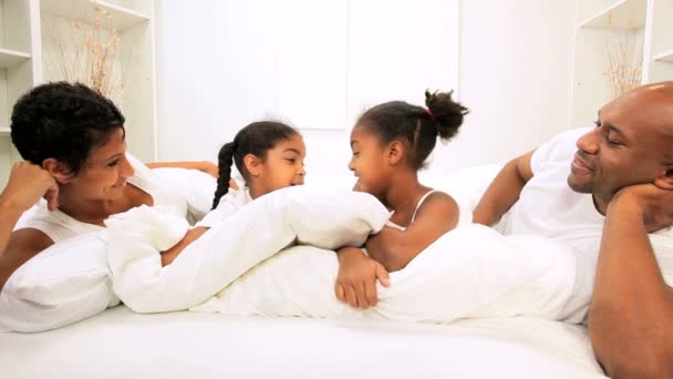 Ethnic Girls Pillow Fight Parents Bed — Stock Video