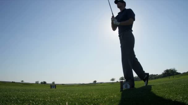 Golfer watching his ball — Stock Video