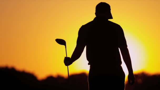 Golfer bending to retrieve golf tee — Stock Video