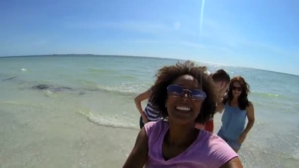Teenagers enjoying time on beach — Stock Video