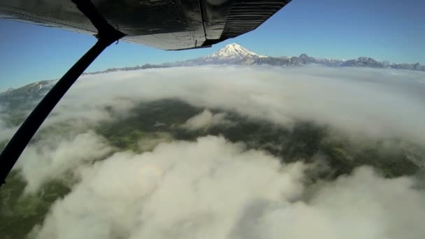 Aerial cloud view of distant Mt Redoubt Volcano Alaskan Wilderness light aircraft, Alaska, USA — Stock Video