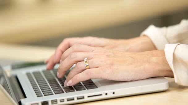 Hands only of young Caucasian female in business suit typing — Stock Video