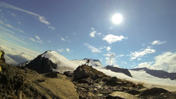 Lone triumphant climber — Stock Video