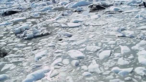 Aerial view broken off ice flows dirt and debris — Stock Video