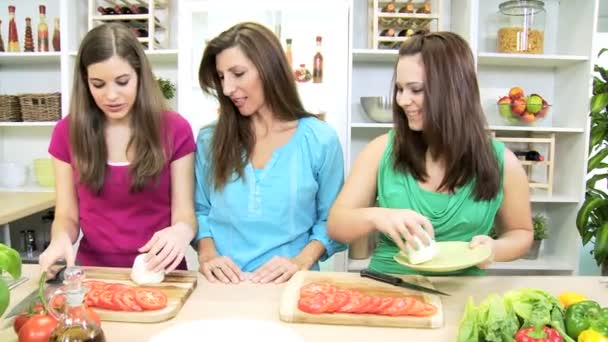 Teenage girls at  home kitchen helping their mom — Stock Video