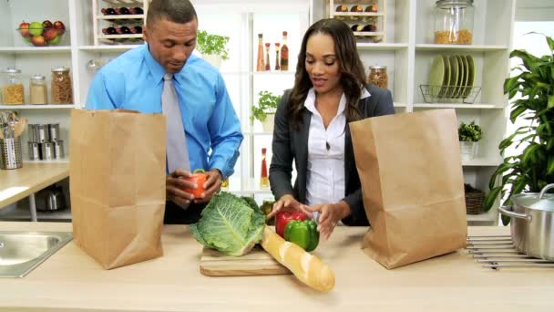 Business couple in the kitchen preparing with tablet — Stock Video