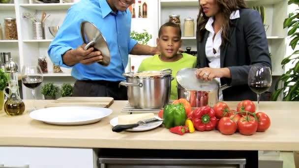 Family prepares soup on kitchen — Stock Video