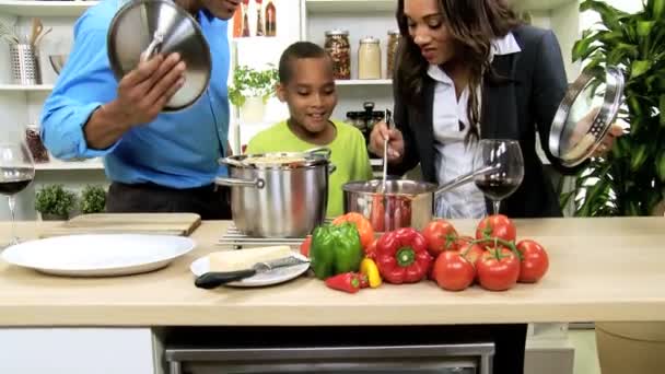 Family prepares soup on kitchen — Stock Video