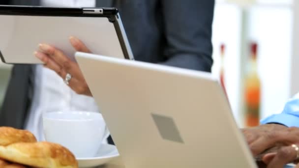 Couple have breakfast and using laptop and tablet on kitchen — Stock Video