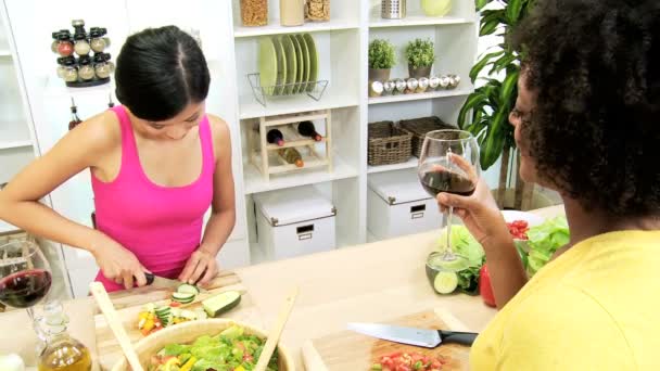 Females preparing salad at kitchen — Stock Video