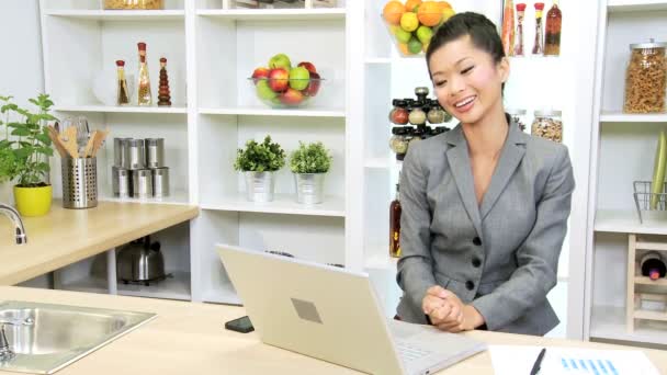 Businesswoman working at home kitchen — Stock Video