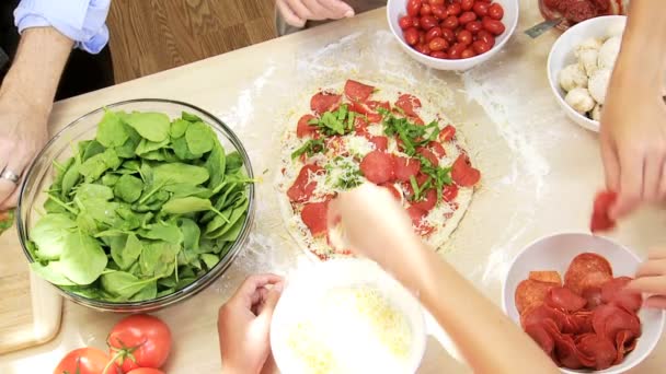 Family preparing together homemade pizza — Stock Video