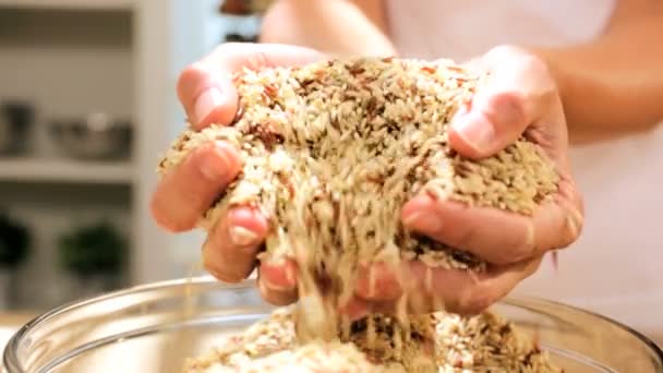 Dry grains running through hands — Stock Video