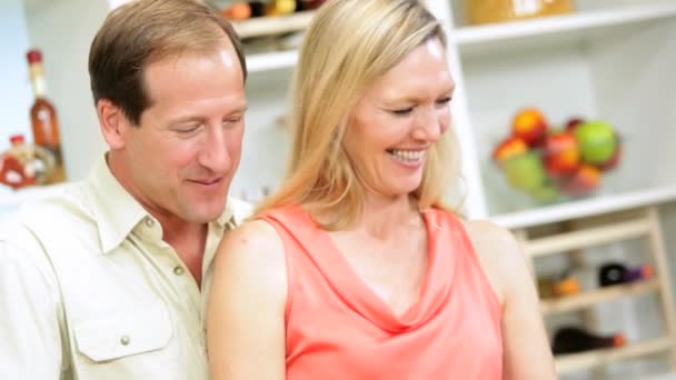 Couple at kitchen preparing dinner — Stock Video