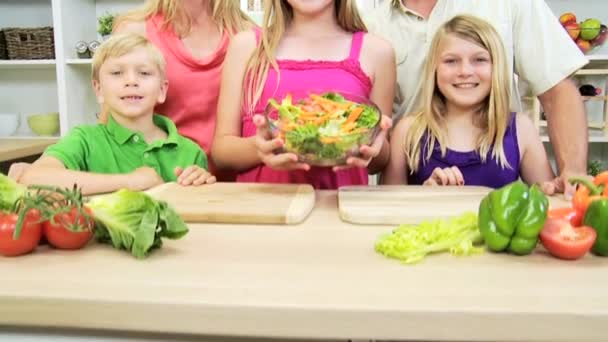 Family at kitchen with salad — Stock Video