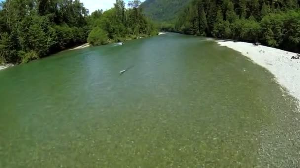 Aerial view turquoise river water forest wilderness rotor blade shadow — Stock Video