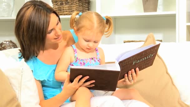 Young Mother Daughter with Photo Album — Stock Video