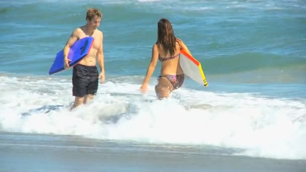 Caucasian Male Female Body Boards Ocean Waves — Stock Video