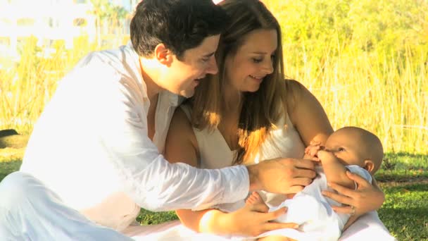 Young couple playing with baby — Stock Video