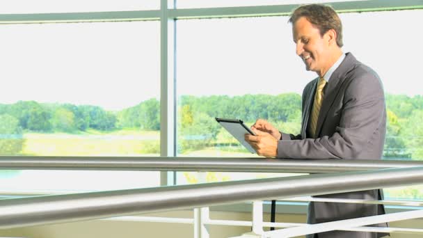 Businessman using tablet in airport — Stock Video