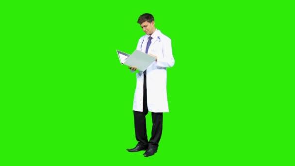 Male doctor reading medical reports — Stock Video