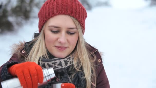 Young girl with hot drink thermal flask — Stok video