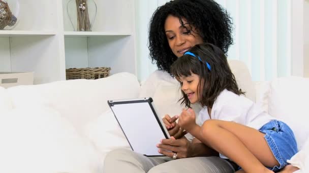 Mother with daughter using wireless tablet — Stock Video