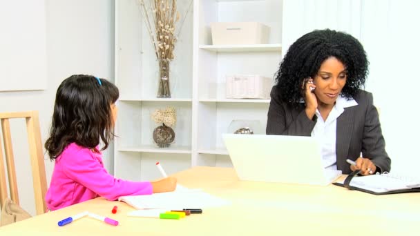 Woman working at home with her daughter — Stock Video