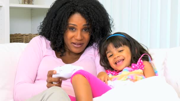 Mother with daughter playing video games — Stock Video