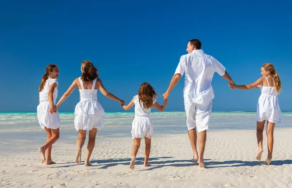 Carefree Young Caucasian Family Wearing Casual White Clothing Walking Sand — Zdjęcie stockowe