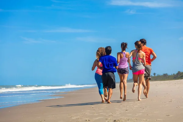 Healthy Young Friends Sportswear Jogging Barefoot Ocean Enjoying Exercise Togetherness — ストック写真