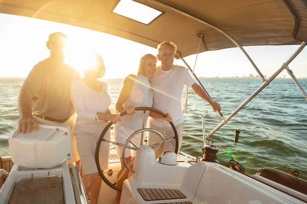 Group Senior Friends Enjoying Fun Summer Vacation Steering Luxury Yacht — Stock Photo, Image