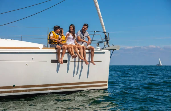 Happy Young Latino Family Sitting Luxury Yacht Children Lifejackets Enjoying — Zdjęcie stockowe