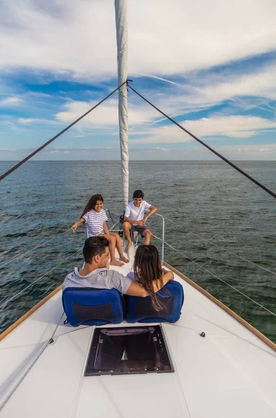 Hispanic Parents Relaxing Together Private Yacht Young Children Sitting Bow — Stock Photo, Image