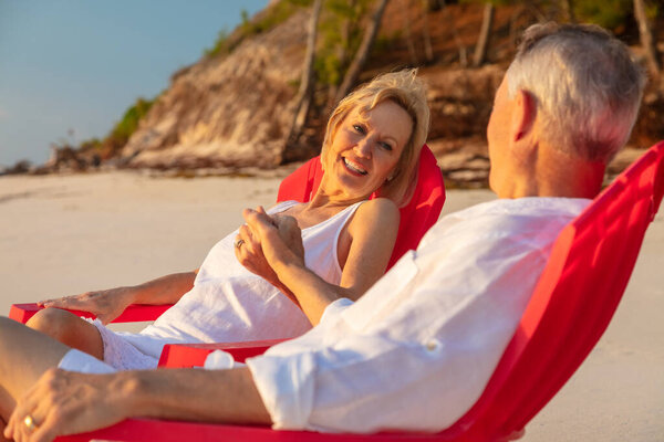 Travel Loving Retired Caucasian American Couple Smiling Holding Hands Tropical Royalty Free Stock Photos
