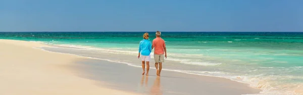 Panorama Tropical Beach Retired Caucasian Couple Casual Clothing Walking Shoreline — Stock Photo, Image