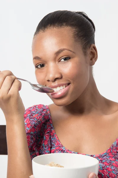 Black Female eating her Breakfast with spoon — Stock Photo, Image
