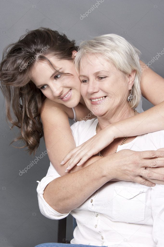 Daughter holding mother close in an embrace