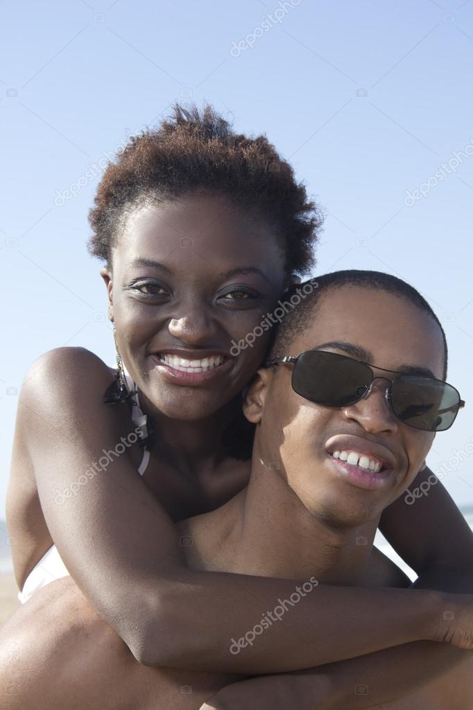 Sexy African American Couple Stock Photo Sexy young African American Couple hugging smiling — Stock Photo © Corlie #42821829